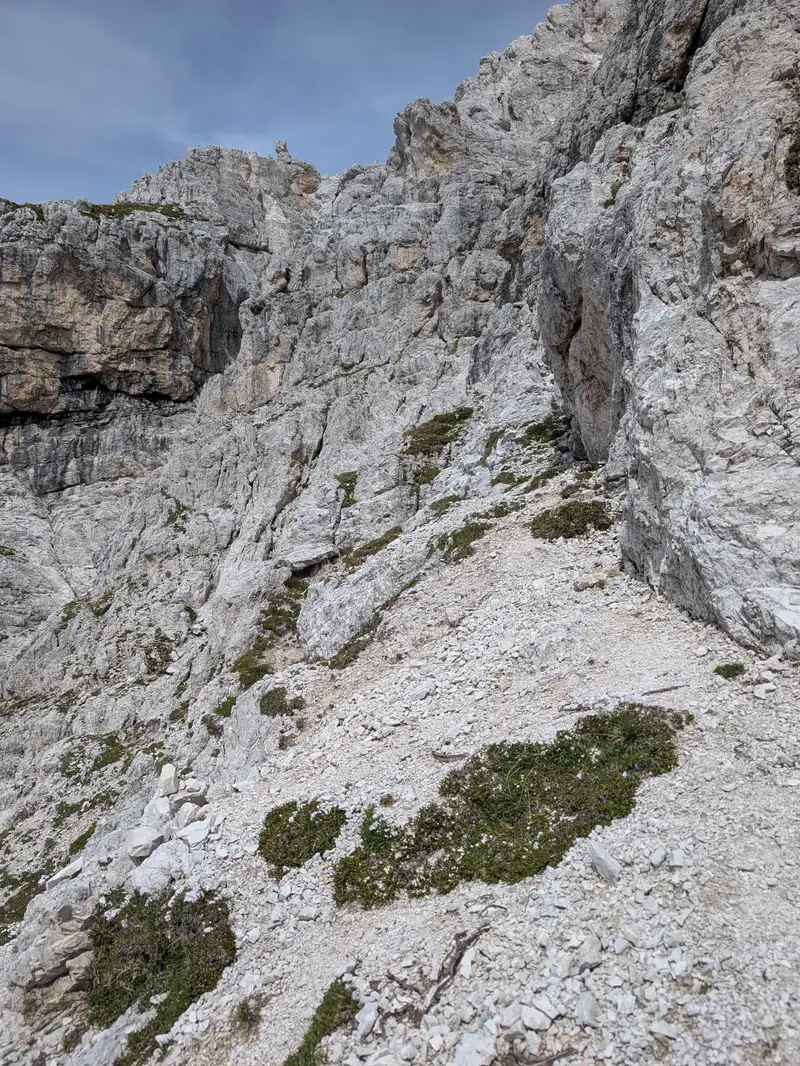 Start of the normal route to Cima del Vallone - ledge variant. View from Forcella del Vallone saddle.