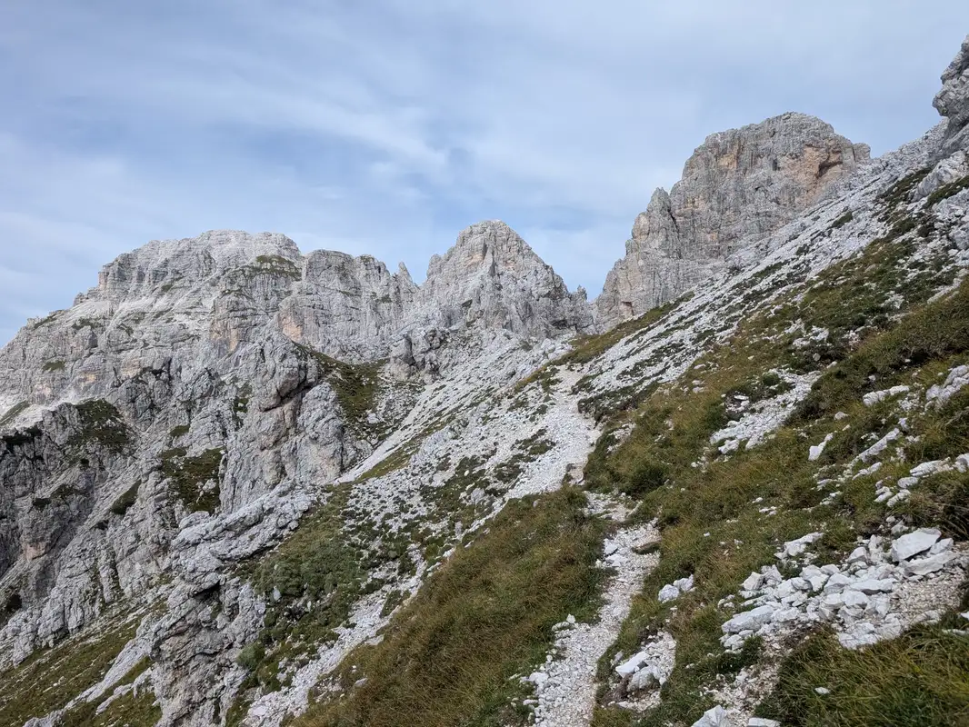 Tarrain somewhere in the middle of Sentiero del Centenario, with Jof Fuart group already visible and Cima del Vallone on the right side.