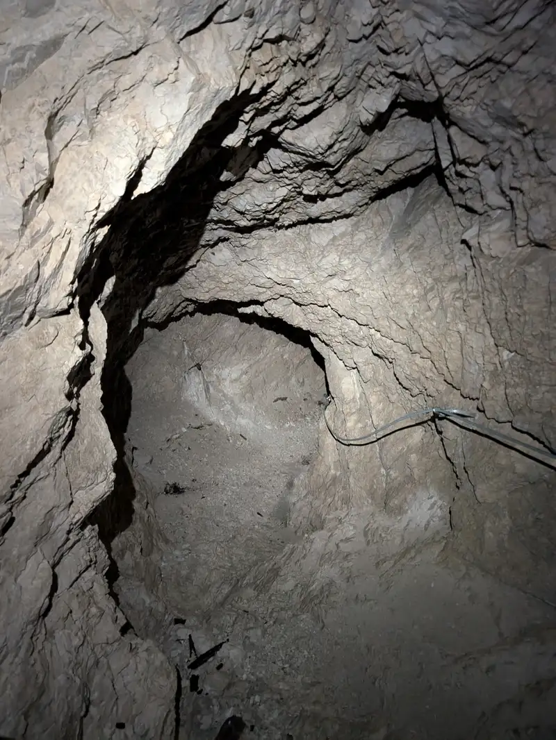 There's a flat part of the bunker with narrow window used to observe the immediate vicinity and a descending hallway protected with wire.