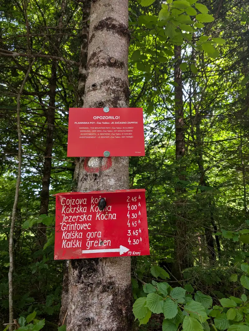 Timetable signpost at Suhadolnik parking lot. These times seems reasonable - at least the one to Grintovec.