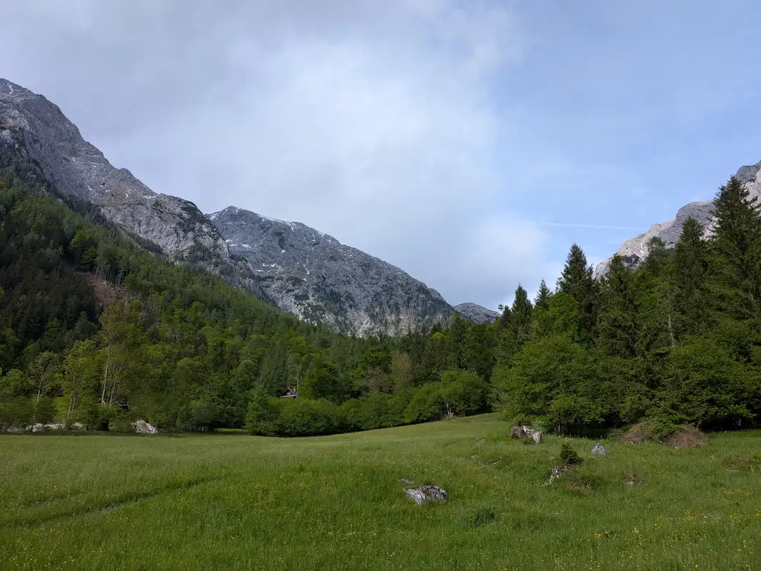 View from Suhadolnik meadow in the direction of Grintovec, that's the peak stretching from the center of the image to the left, covered at some point by Jezerska Kočna on the left.
