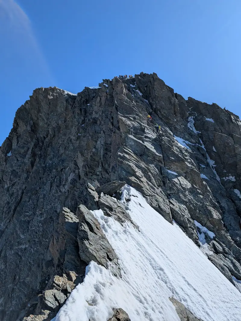 Final section of the climb, the summit can already be seen. Last harder spot will be that fixed hemp rope with knots to help us climb that overhanging slab. Then there is some wire. 