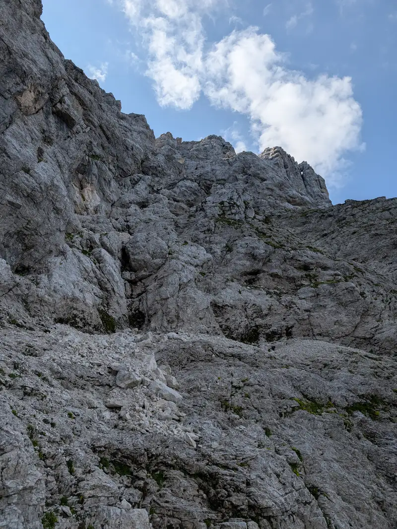Getting closer and closer to exit tunnel window (not visible from here). Here couple of variants are possible. We kept left and climb was easy however it might be a good idea to look for a way and cairns a bit to the right - to avoid a cautious traverse in the upper part. 