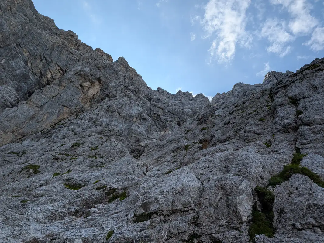 Climbing up, approaching tower with yellow broken rock.