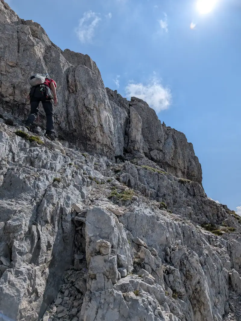 Searching for a path to enter the main ridge. Sun shines again, we are on southern side.