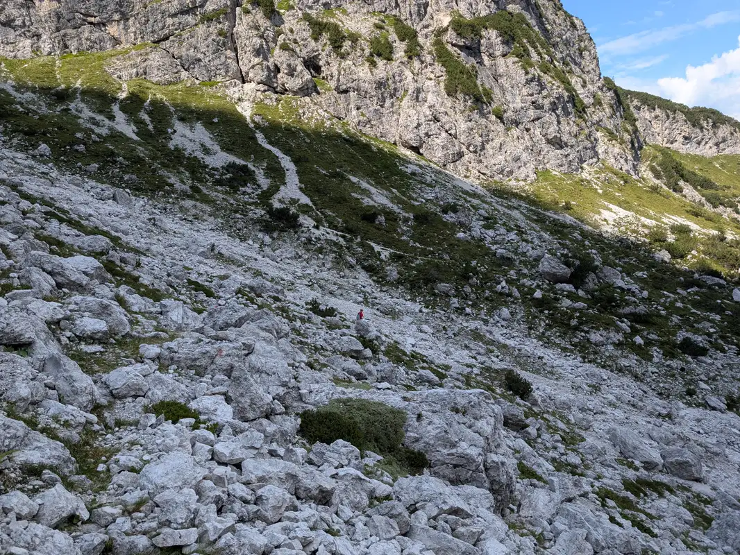 ... crossing a giant scree and we land on more humanly trail. Slopes of Grande Nabois in the background.