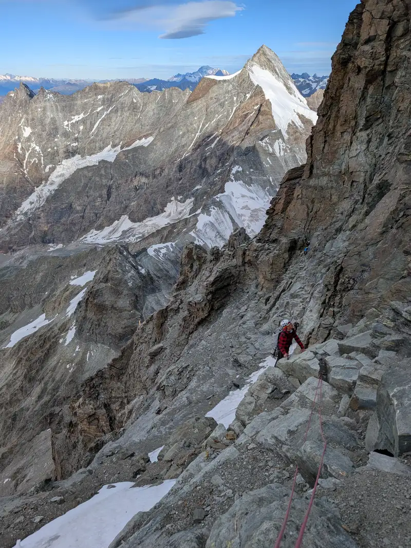 A bit exposed but easy horizontal traverse, fantastic photo spot. There is piton to place your own protection.
