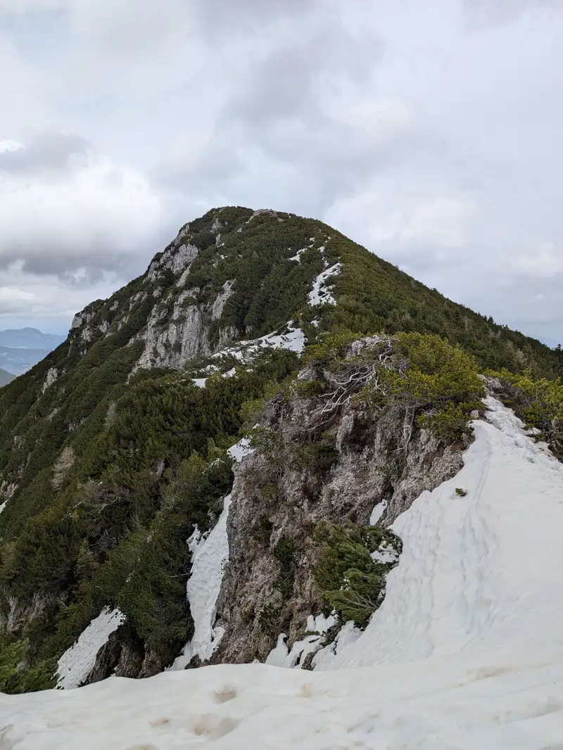 Monte Re as seen from pre-summit. We were lucky enough to be able to cross that snow without winter equipment and without winter boots. Might be trickier with more snow around. 