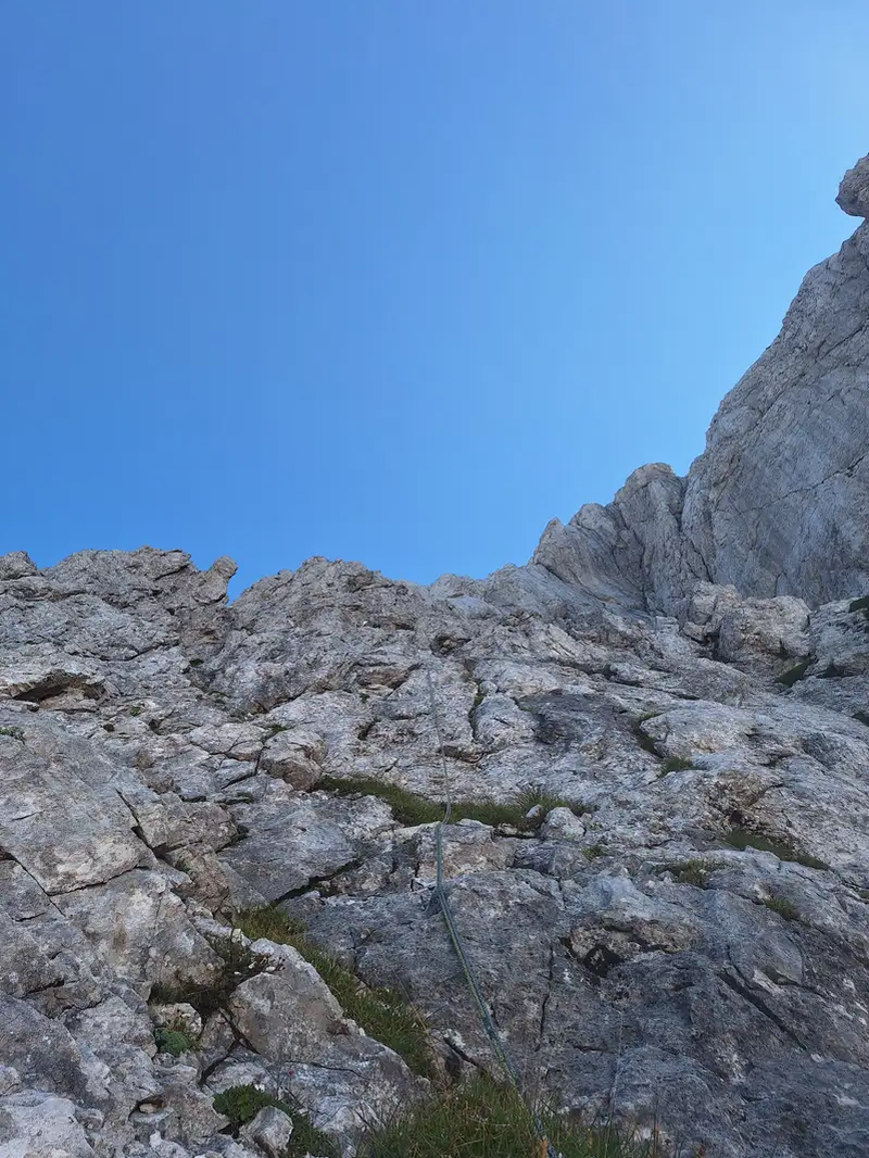 Terrain at the start of the route. Look for a loop which makes the first stand. Watch out as the rock here is brittle in places.