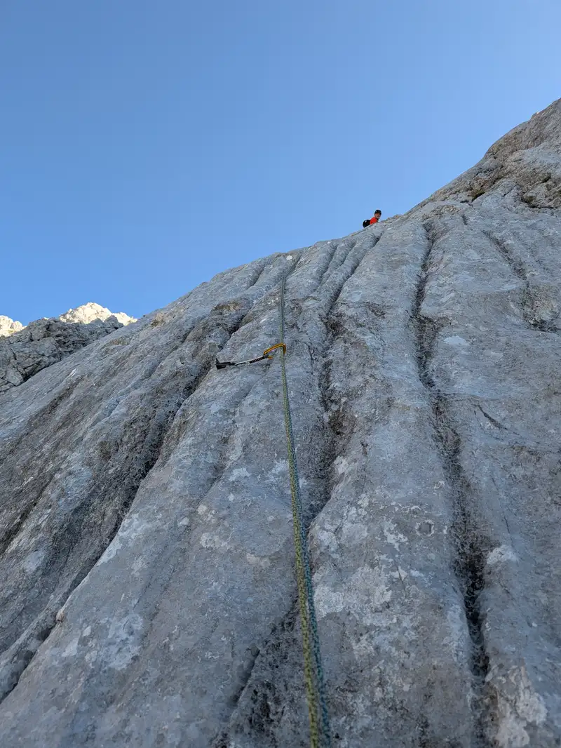 Finishing second pitch - first sloping slab intersected by carved cracks - there will be more of these to come.