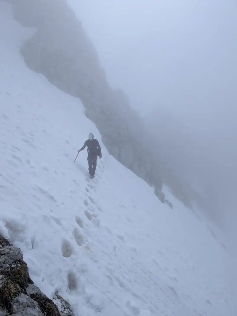 Crossing the snowfield just below the summit of Špik. Somewhere around here our route joins with Kačji graben trail.