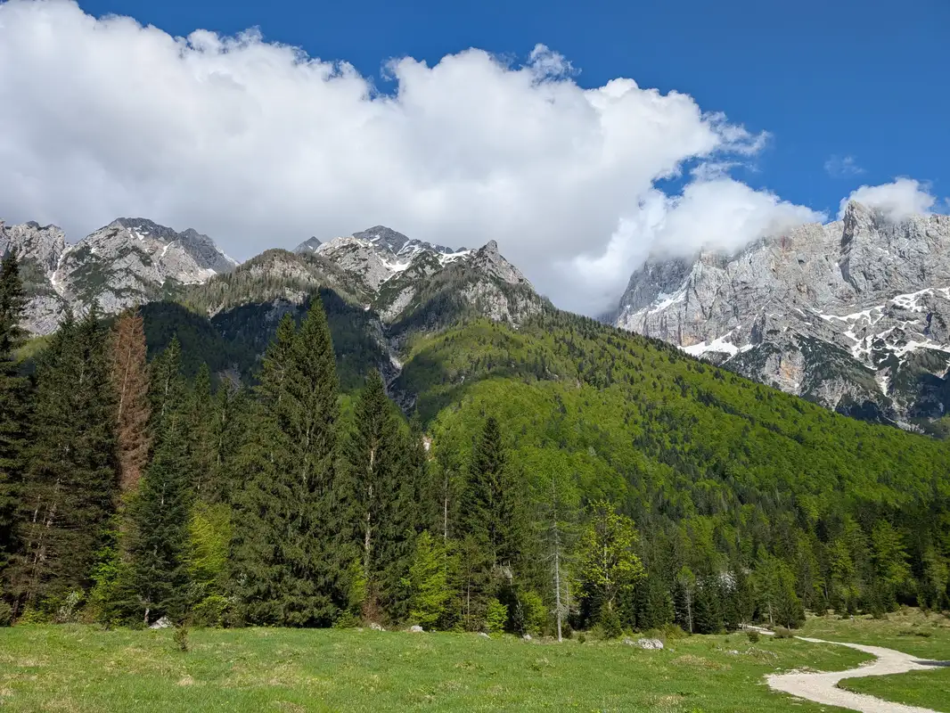 Setting off and cutting through Krnica valley. Špik and Lipnica peak can already be seen. This photo was taken on the way back because in the morning peaks were hidden in the clouds.