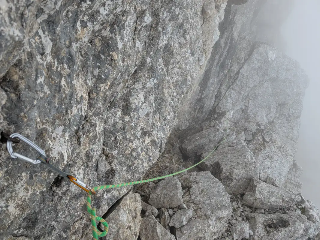 Last pittons on the route, reasonable spot for final belay - didn't use as the last two pitches we did a simul-climbing. They lie below quite distinct black wall. Now a bit of traverse and we leave difficulties.