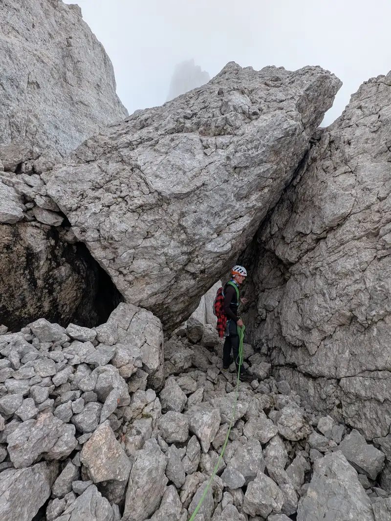 Below the peak of Macesence. Peak is on the left, climb is easy and takes not even 5 minutes from here. Now, under that block and downclimb to the ridge connecting with Stenar (barely visible in the background)