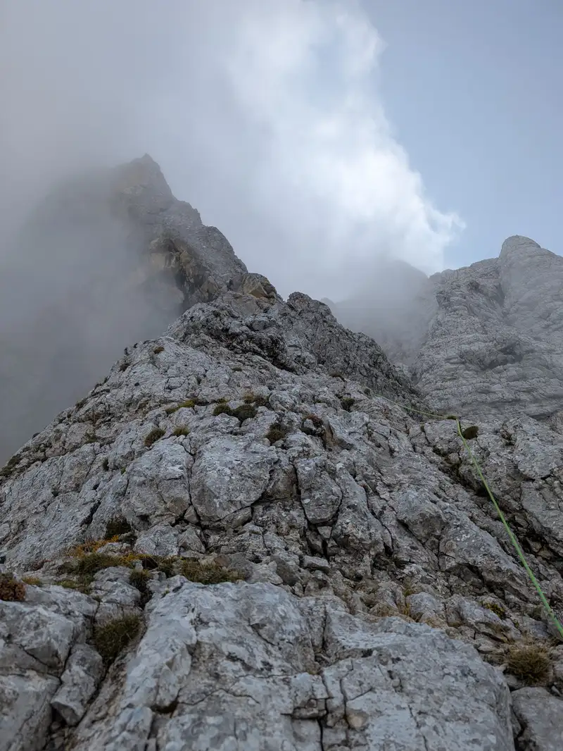 Terrain in third pitch, general direction is that triangular yellow overhanging rock.